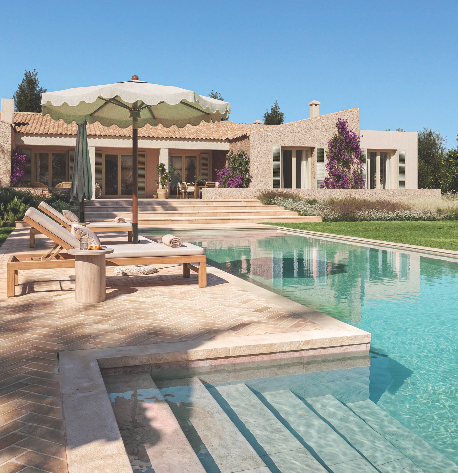 Fachada sur de la villa con la piscina en primer término